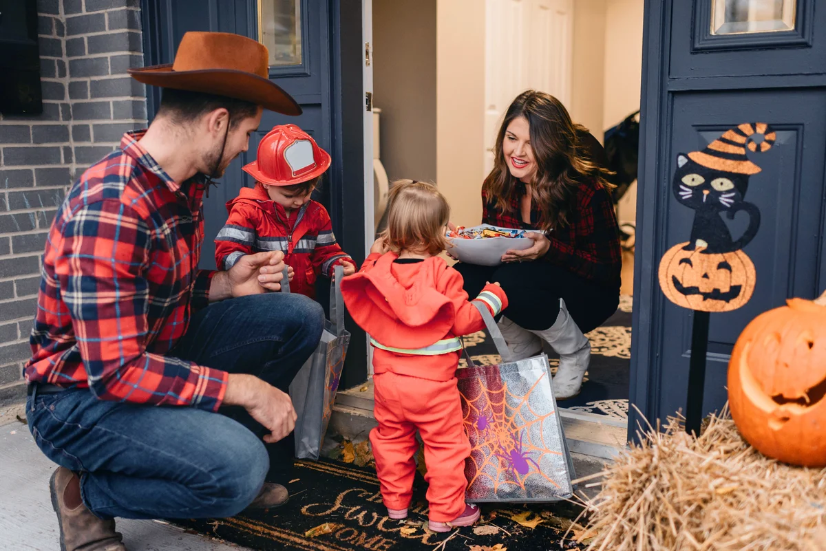 Family dressed up for Halloween trick or treating