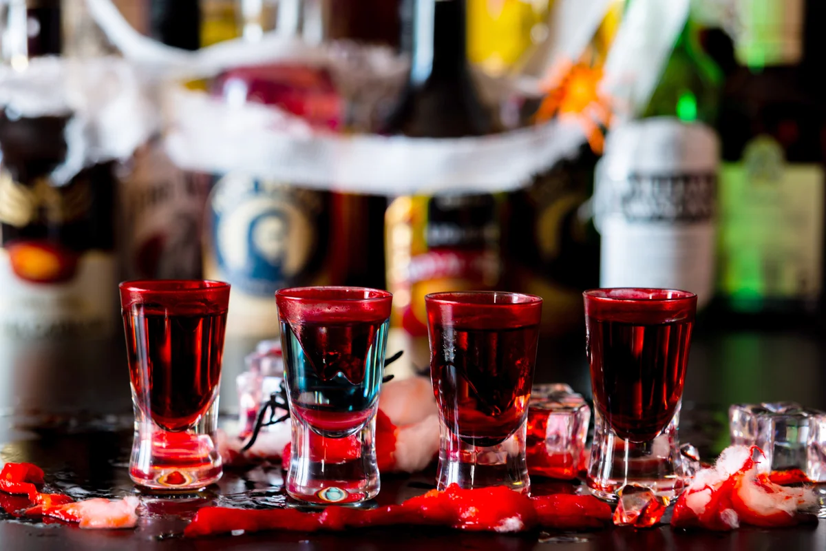 Creepy halloween party shots with blood and spiders