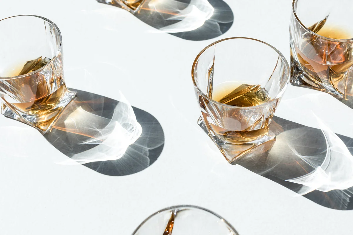 cognac in glasses with shadows