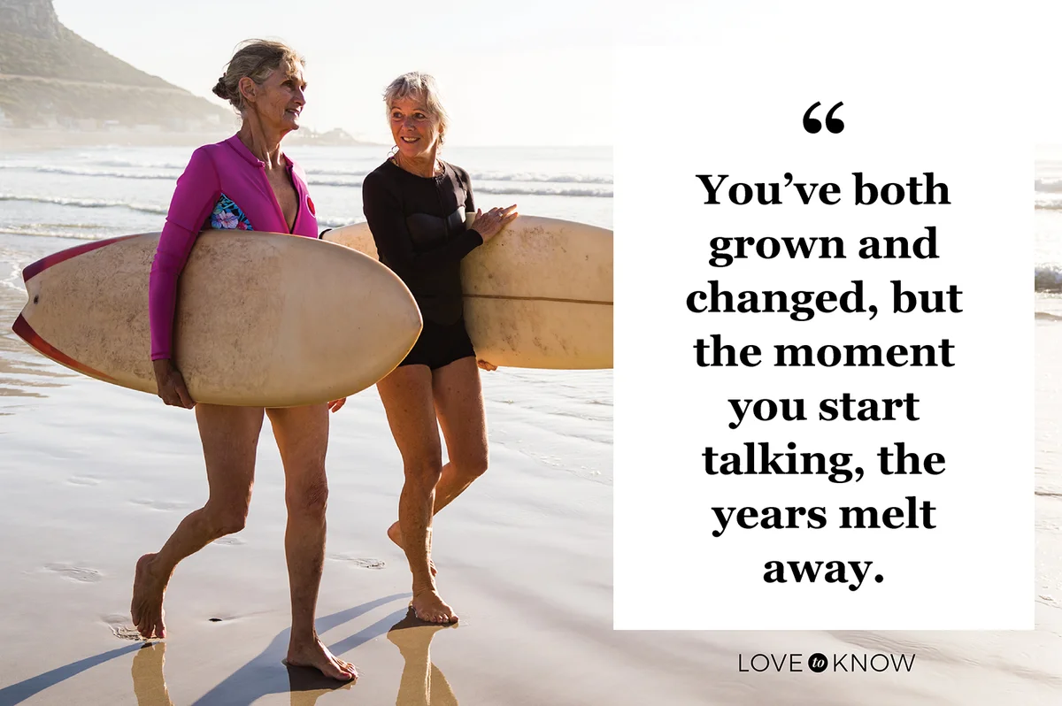 Two senior women going for a morning surf in the sea