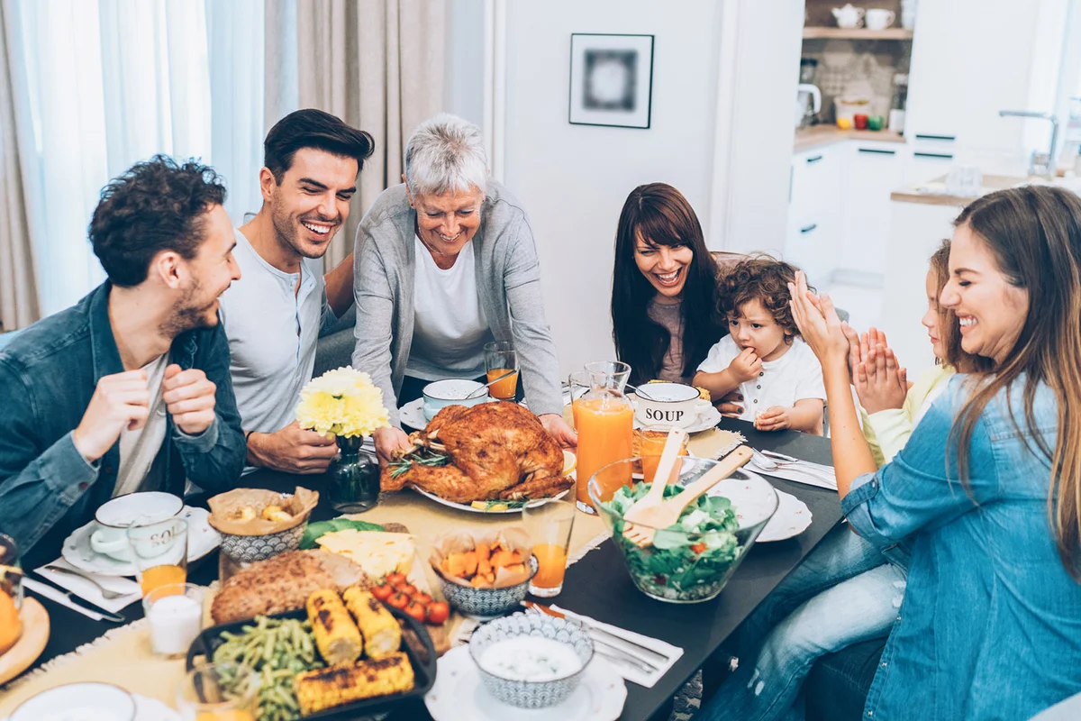 Senior woman serving roasted turkey