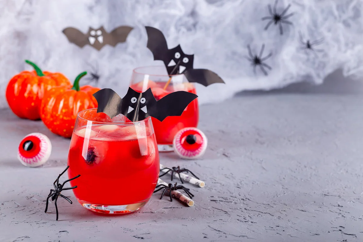 Halloween cocktail with red bubble drink and eyes made from lychee and blueberry