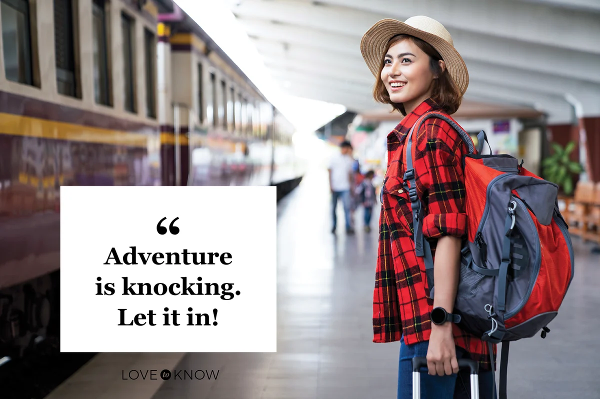 Woman traveler with backpack in the railway