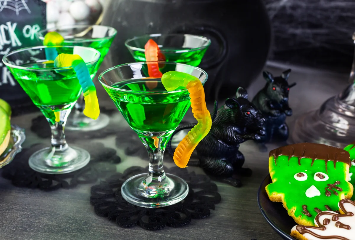 Halloween green cocktails with gummy worms