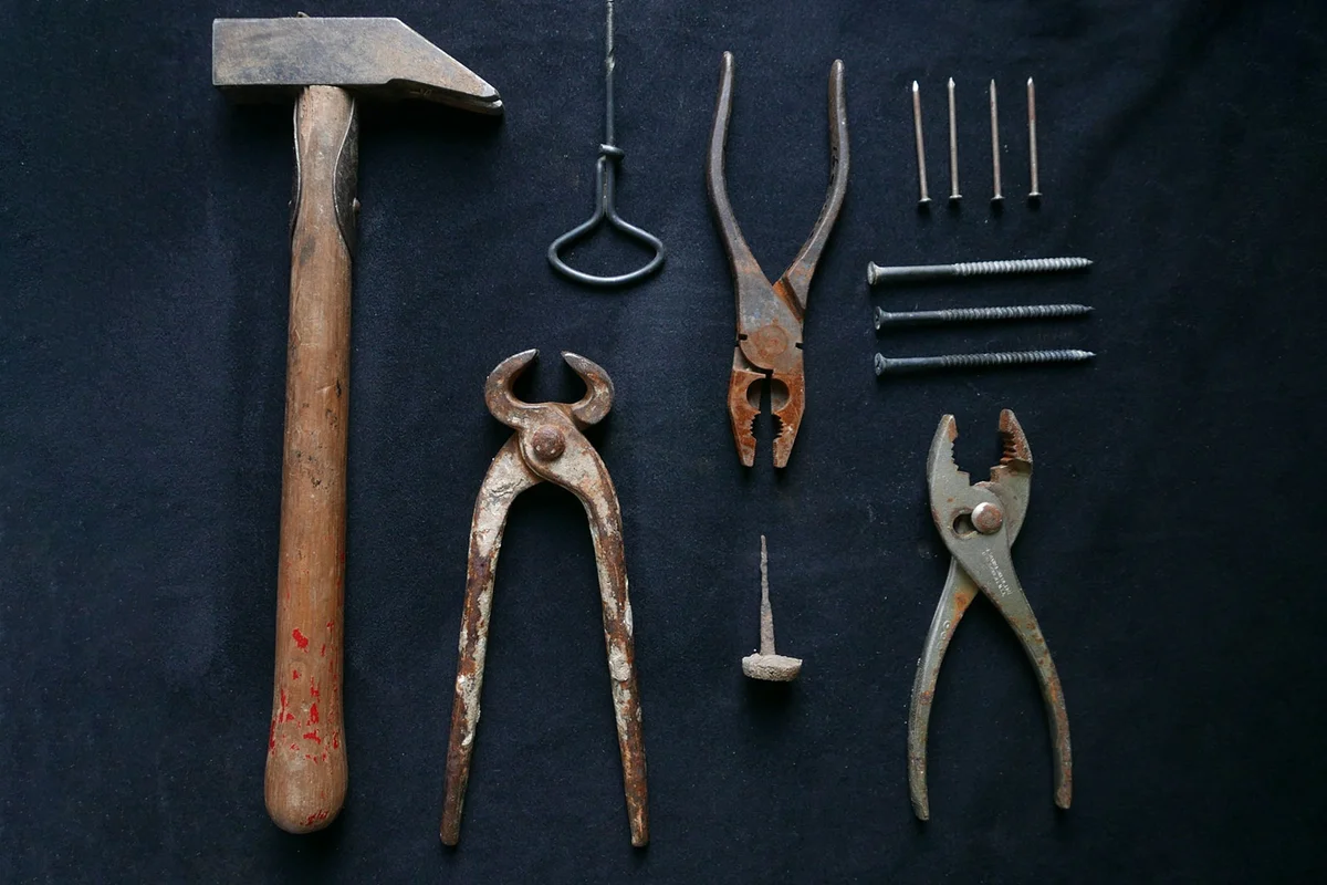 variety of antique tools displayed on table