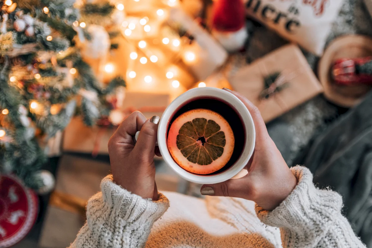 drinking tea by Christmas tree