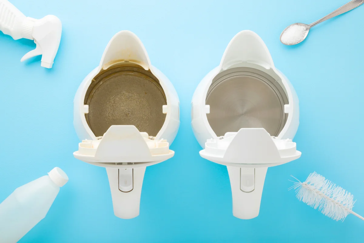 Bottles, brush and spoon with white powder of citric acid for descaling kettle