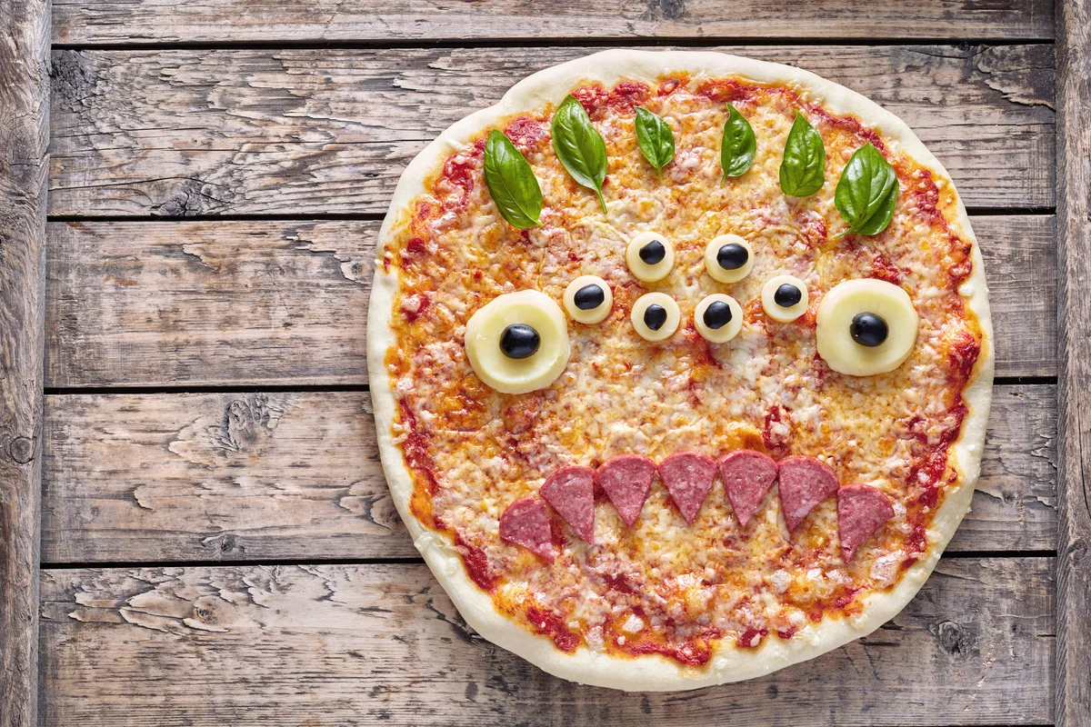Halloween creative scary food monster zombie face with eyes pizza