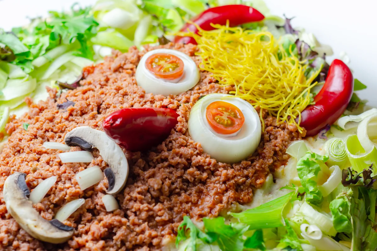 Minced meat formed in the shape of a face of the devil