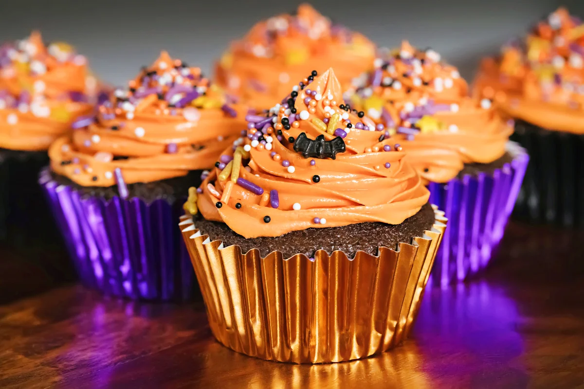 Halloween Inspired Cupcakes in Orange, Purple, and Black Wrapper