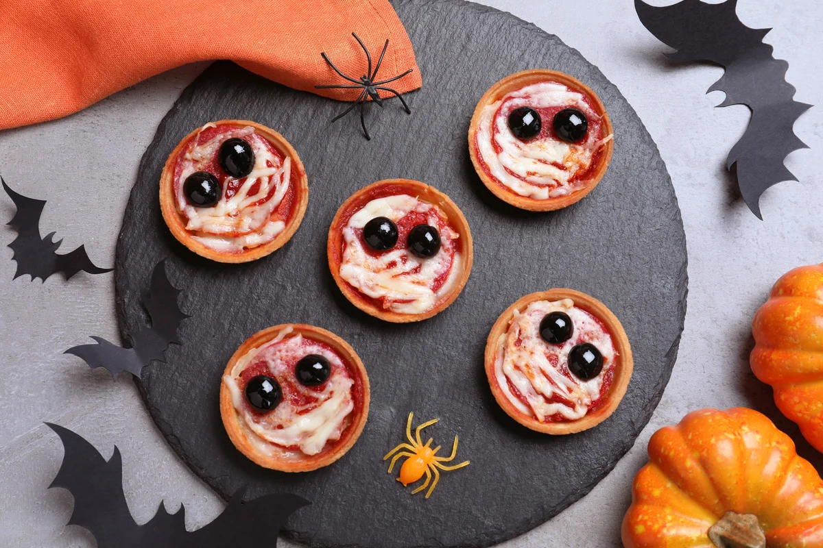 Cute mummy tartlets served on grey table
