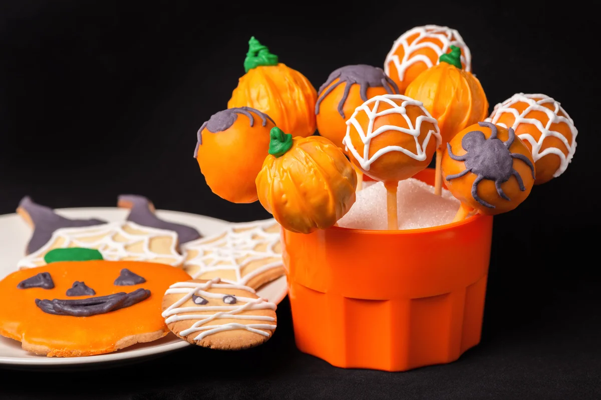 Halloween glazed cake pops and cookies decorated spider web