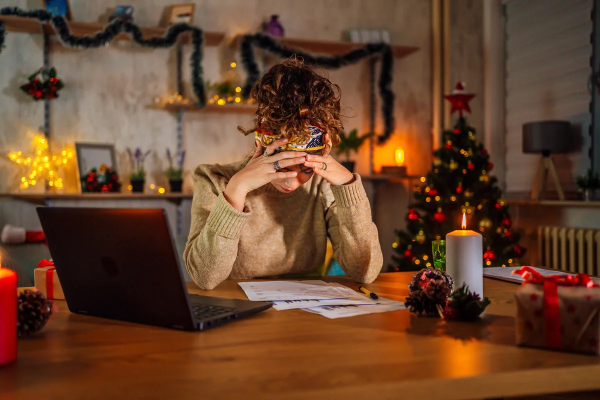 Young overworked woman during Christmas holidays
