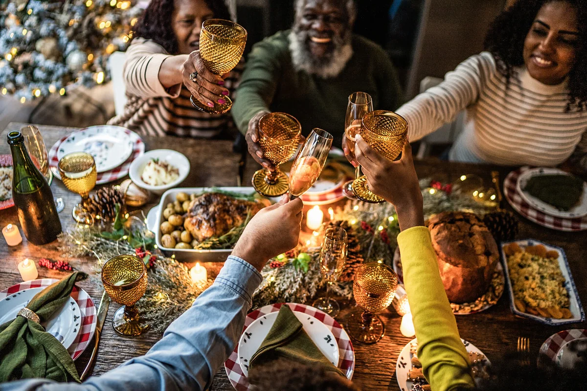 Family toasting on Christmas dinner at home
