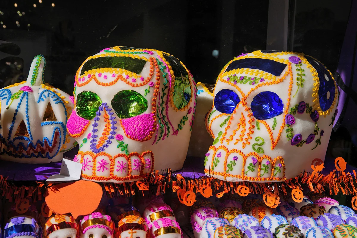 Sugar pumpkin and sugar skulls in a store window Mexico