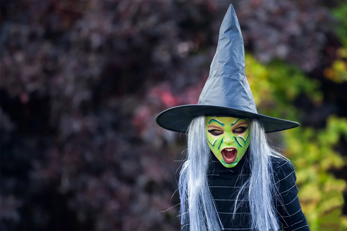 girl in a Halloween witch costume