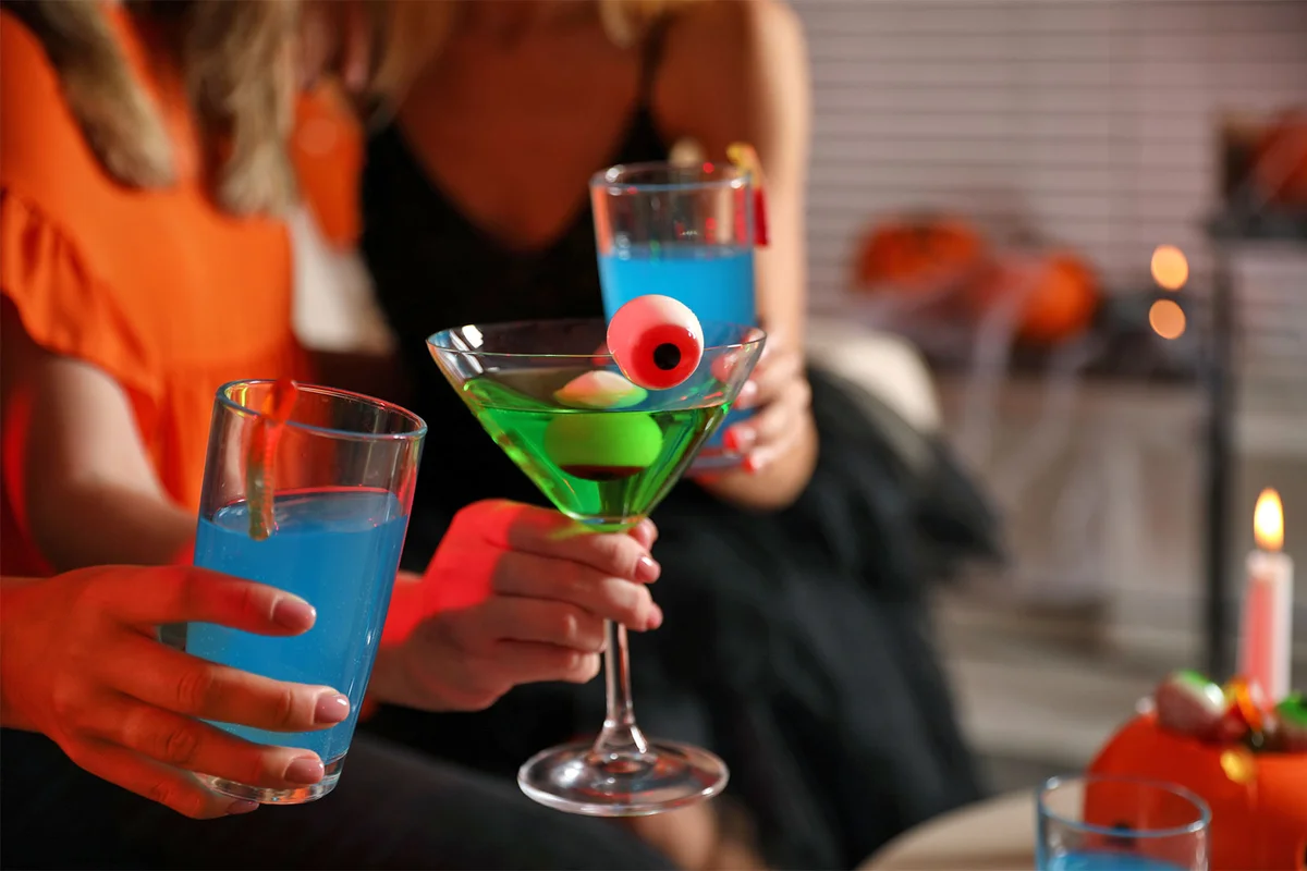 serving Halloween cocktails at house party