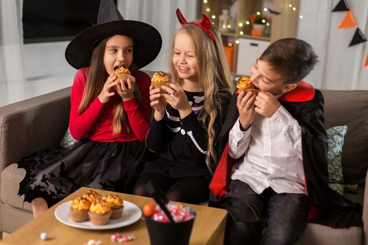 children eating Halloween cupcakes
