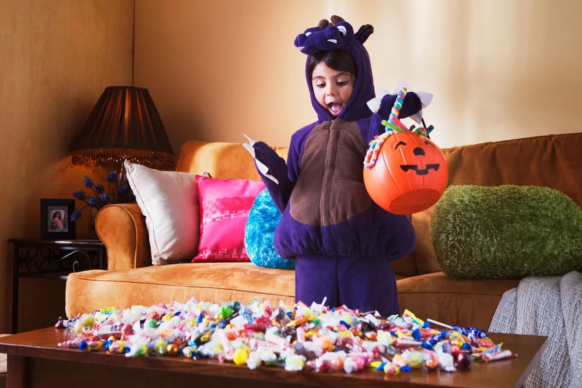 girl trick or treating at home