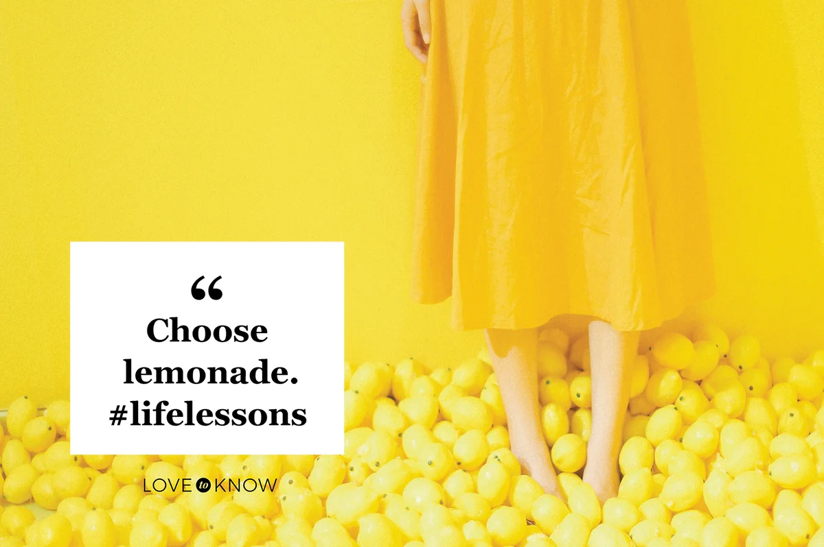 Woman Standing On Lemons Against Yellow Wall