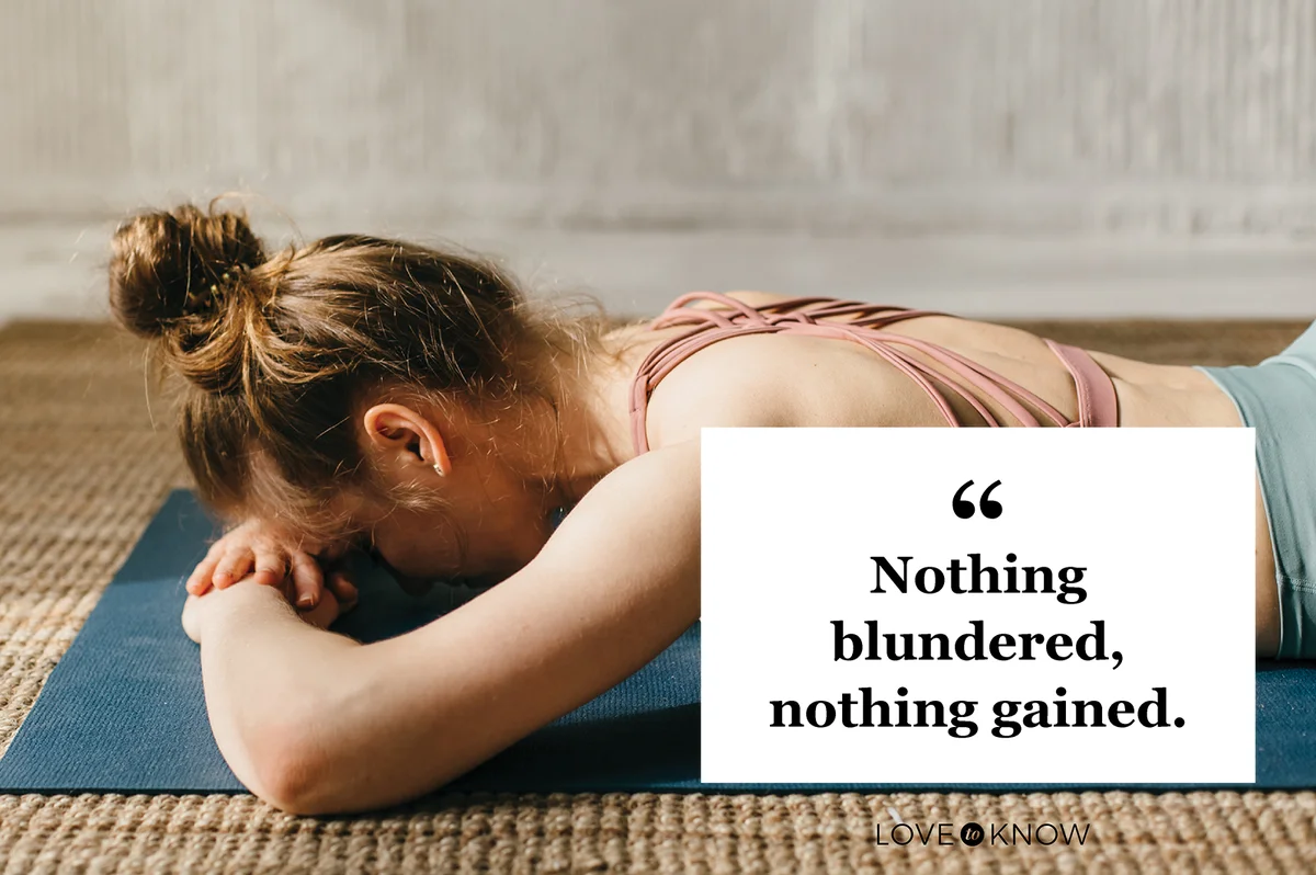 Young woman practicing yoga in yoga class on exercise mat