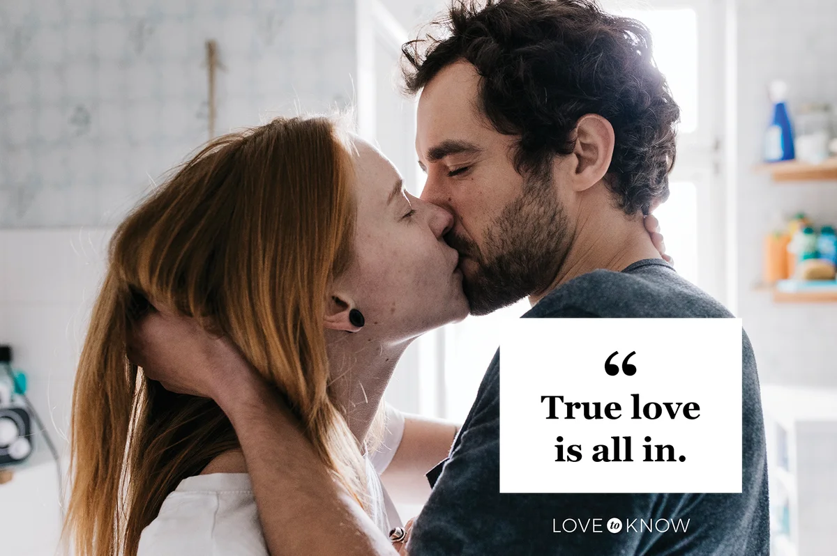 Couple Romantically Engaged In A Kiss