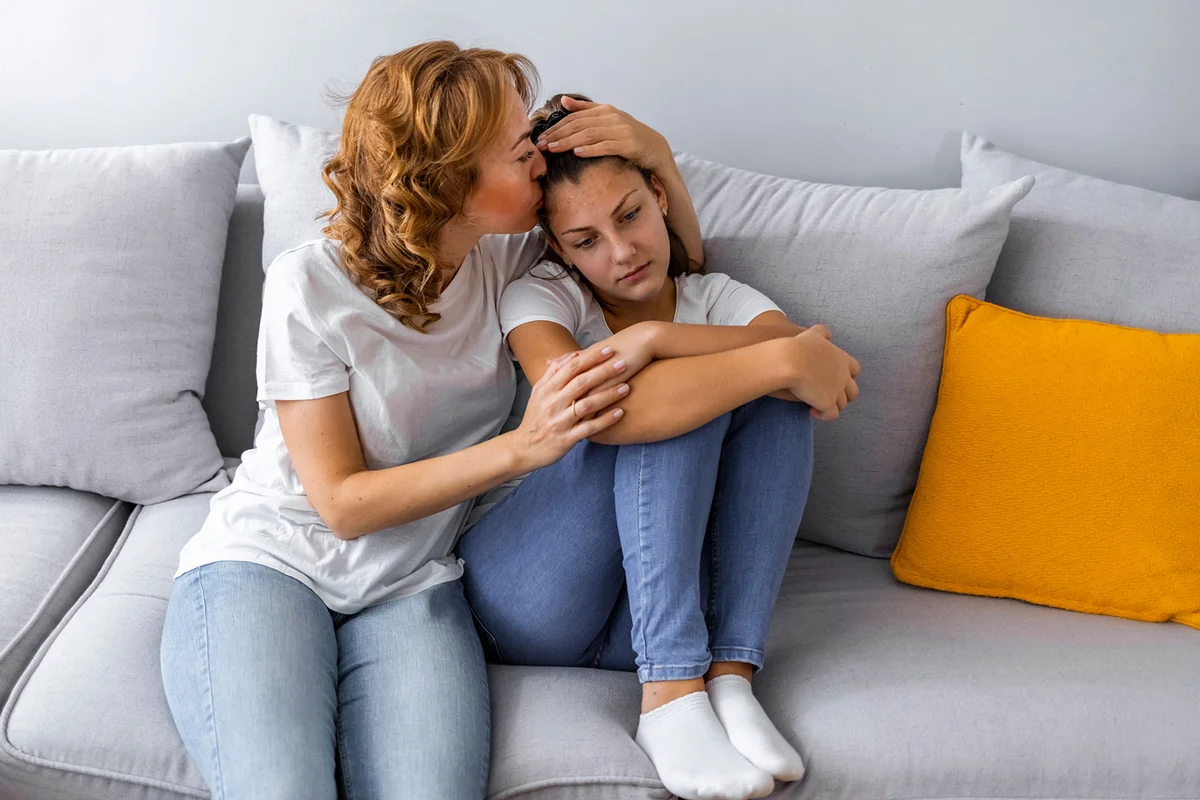 mom supporting teenage daughter