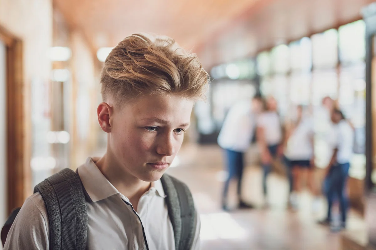 teenage boy sad at school