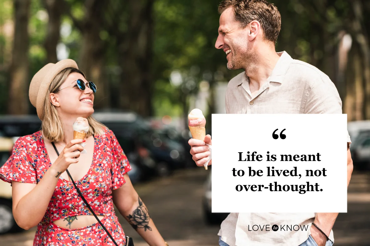 Couple having fun on street eating ice cream