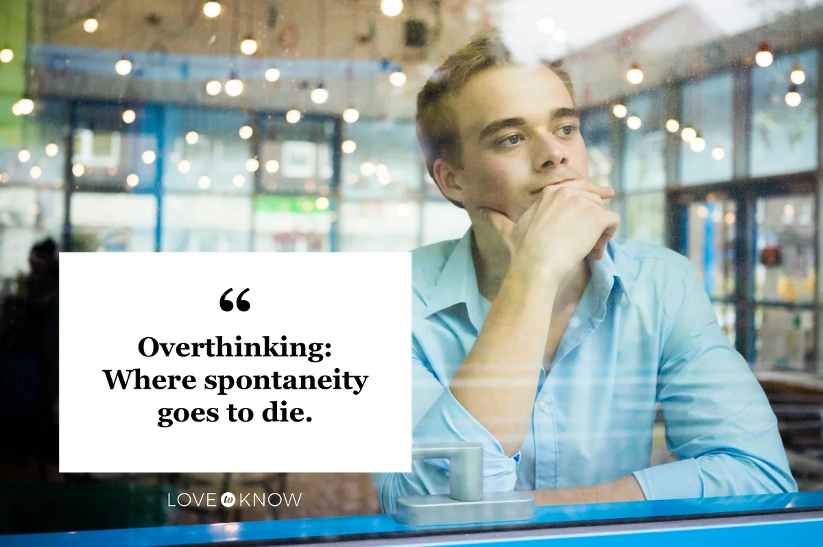 man looking out window of restaurant overthinking life