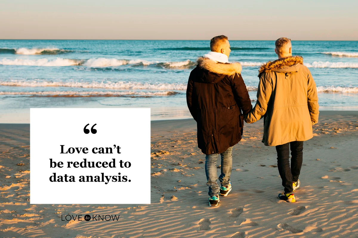couple walking on beach holding hands
