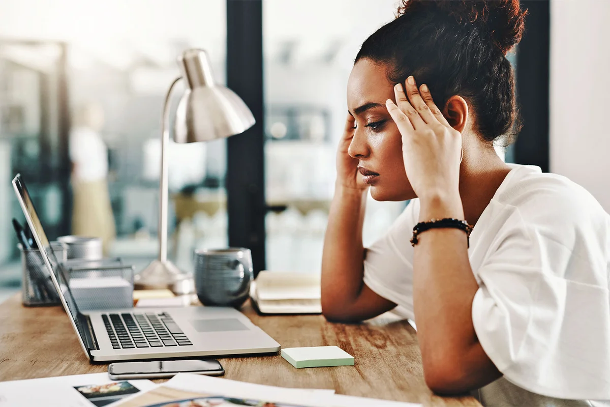 woman overthinking life at office desk
