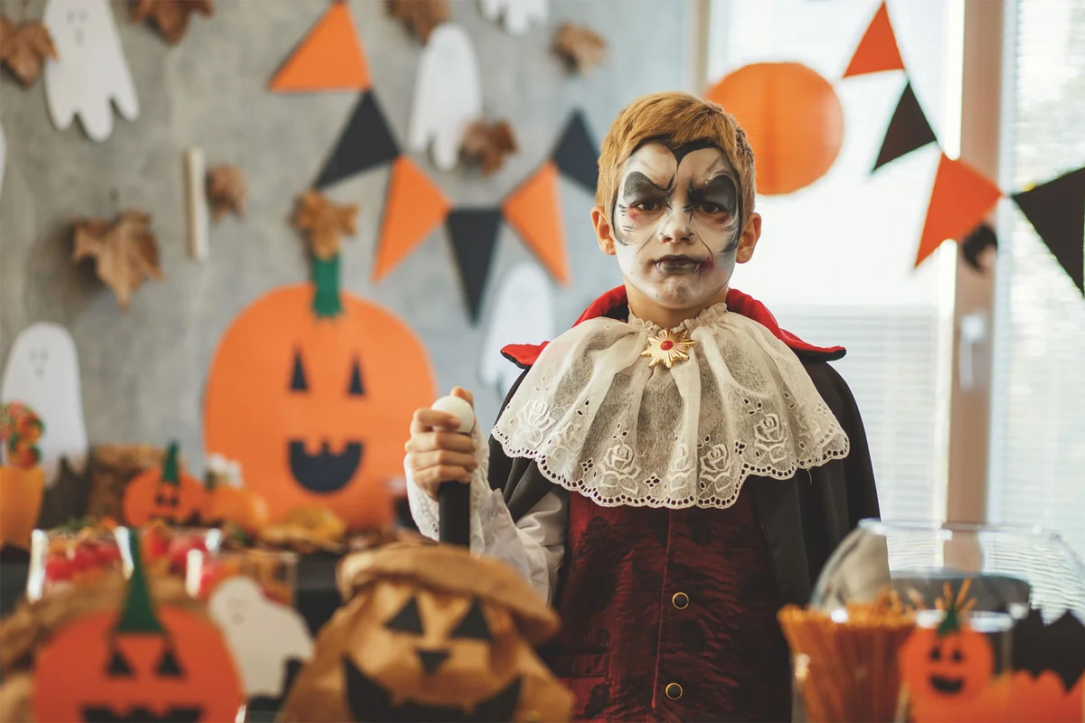boy in vampire costume at Halloween party