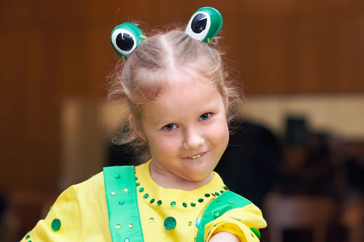 girl in rainforest frog costume