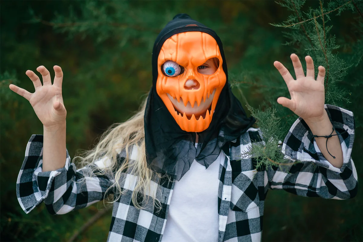 teenage girl in monster pumpkin costume