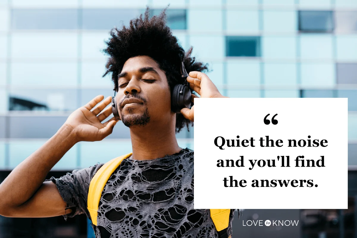 Portrait of man listening music with cordless headphones