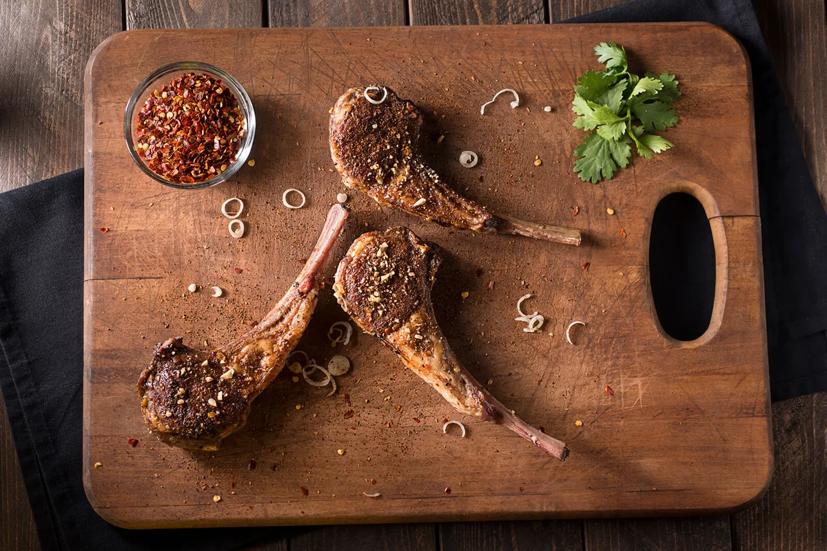 Lamb Chops on a Wooden Cutting Board