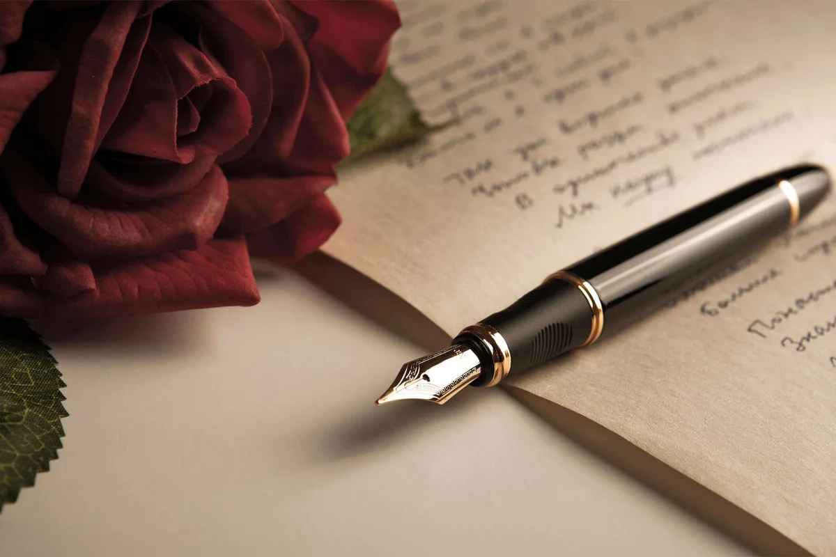 poetry for a funeral rose and pen on paper