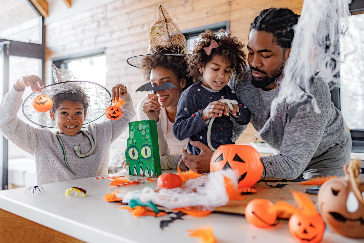 Family doing Halloween crafting