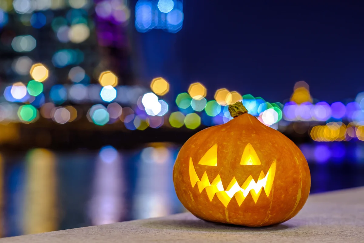 Halloween pumpkin on the background of the night city
