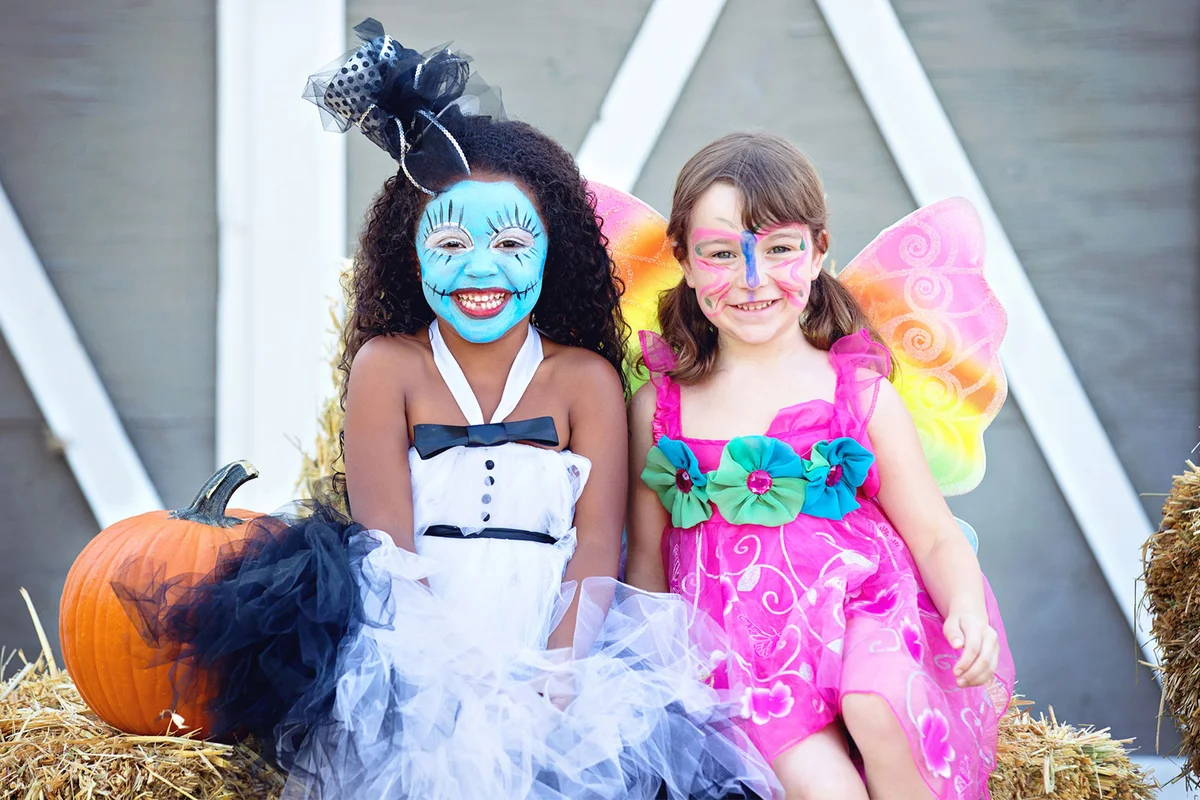Face painting activity at outdoor Halloween party
