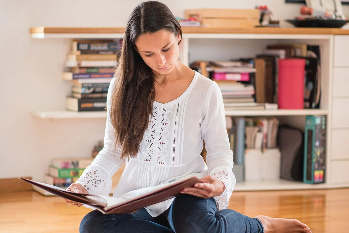 woman missing mother looking at photo album