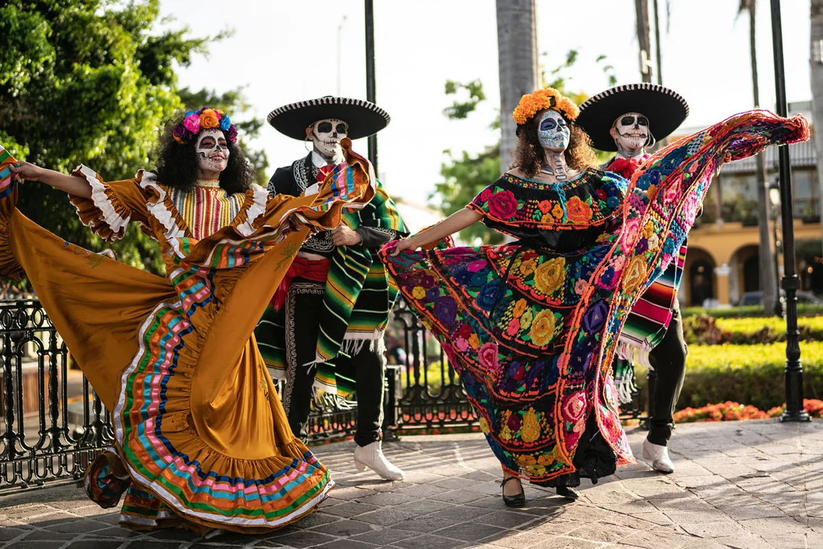 day of the dead dancers performing in costume