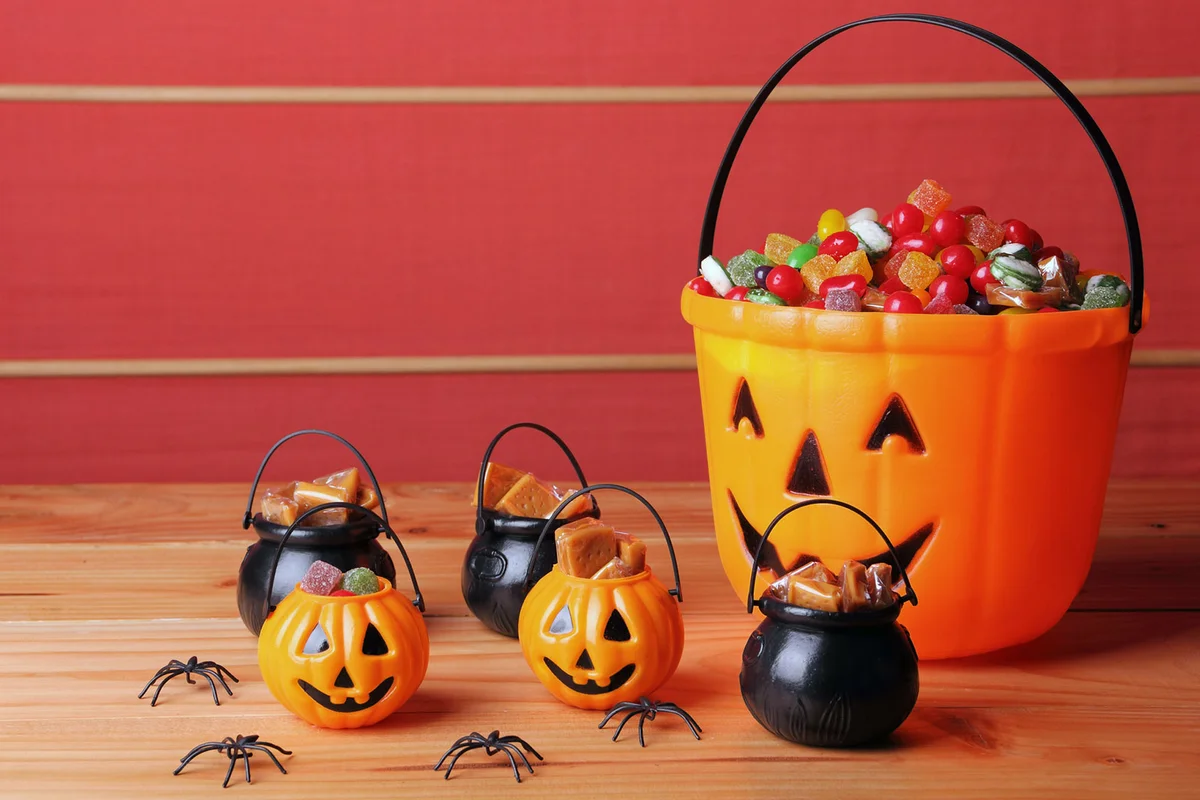 Halloween decoration bucket of candy and toy spiders