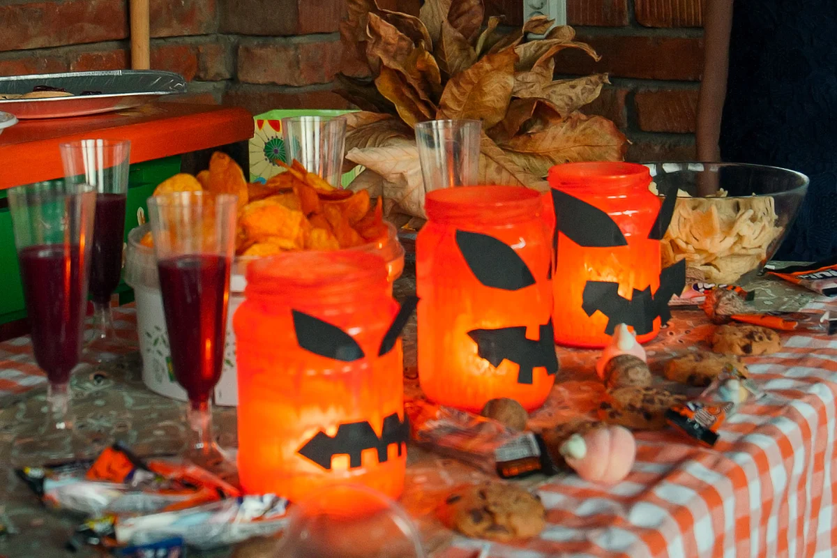 Halloween jack-o-lantern jars for table decoration