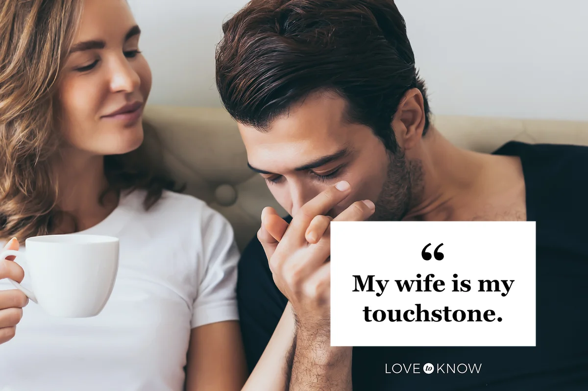 Man kiss wife's hand softly with love while drinking coffee together