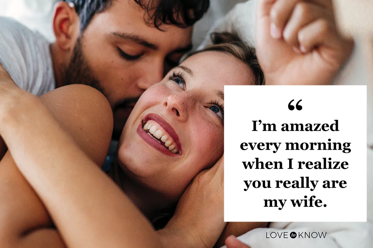 Young romantic couple lying on bed at home