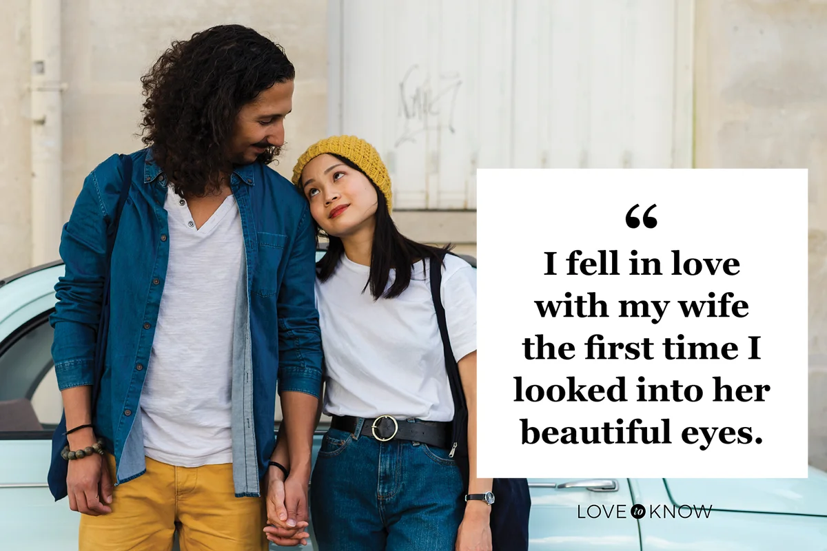 Young couple in love standing at small car