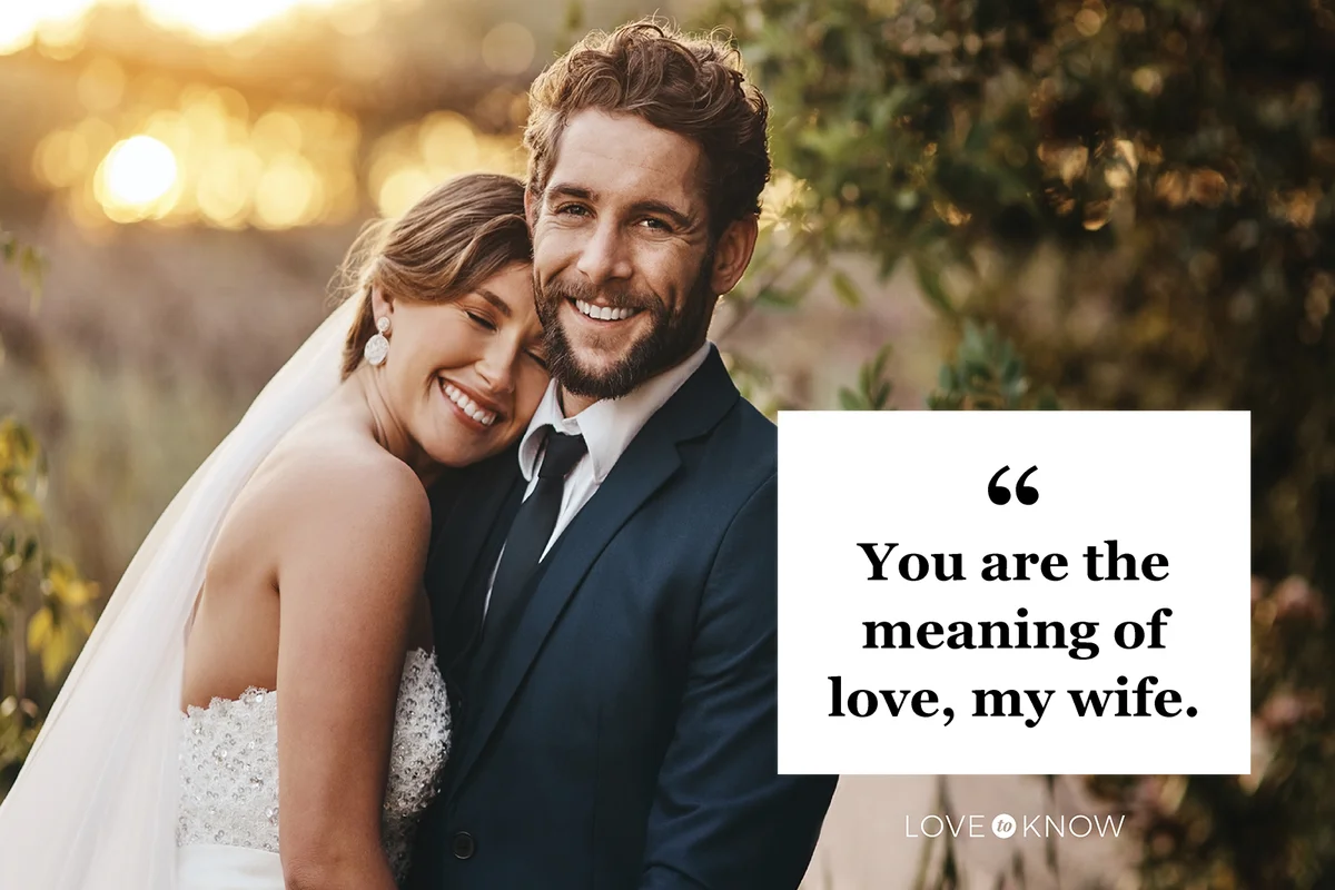Happy young couple standing together on their wedding day