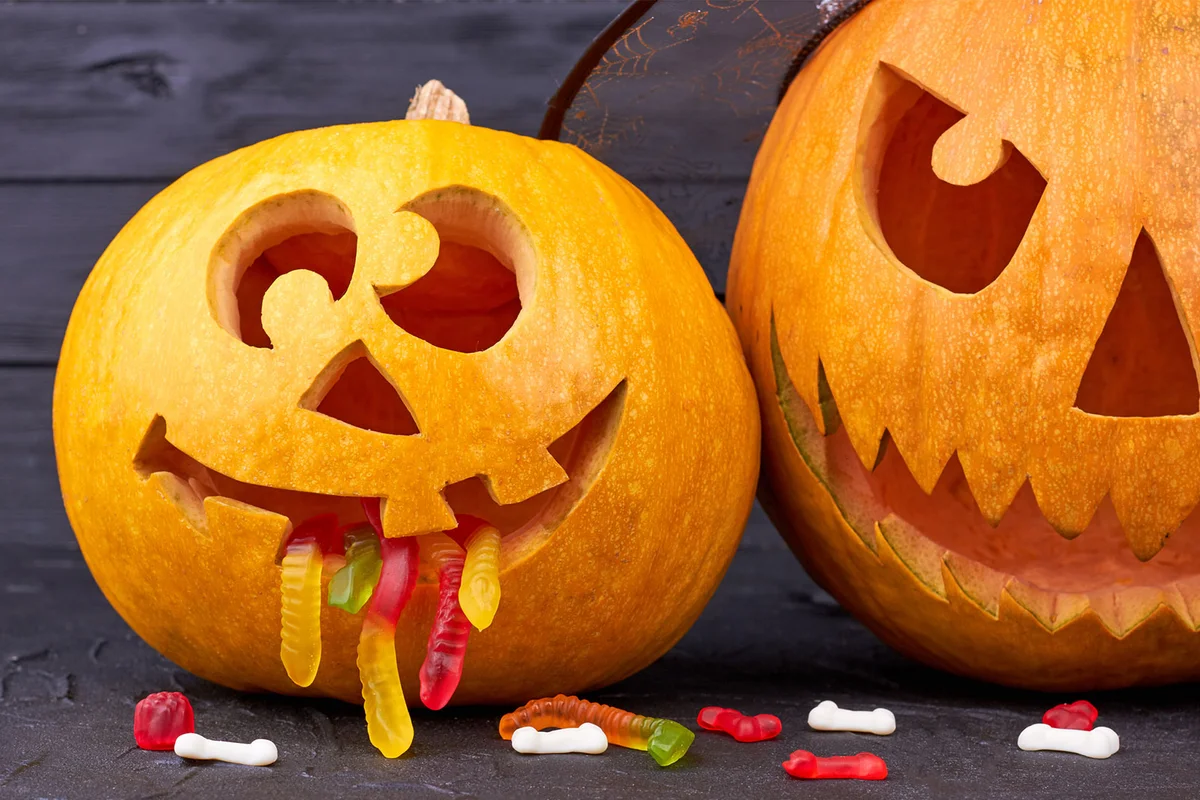 pumpkin spilling gummy worms candy out of mouth